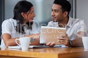 May my words of wisdom haunt you. two businesspeople sitting at a desk in a modern office.