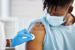 You might have a little bit of bleeding. a doctor holding a cotton ball against the arm of her patient.