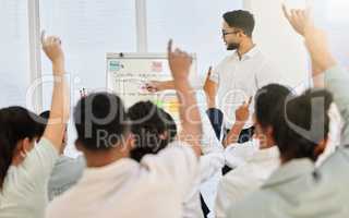 They have questions. a handsome young businessman giving a presentation in the conference hall.