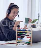 Everyone who remembers his own education remembers teachers. a young teaching an online lesson with her laptop at home.