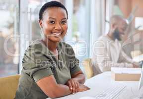 Want my advice Dont let anyone tell you that you cant. a young businesswoman sitting at her desk.