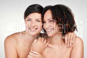 Natural beauty will always be best. two beautiful mature women posing against a grey background in studio.