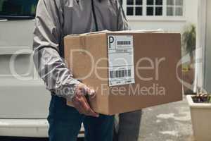 Delivery to your door step. a unrecognizable man delivering a package to a customer at home.