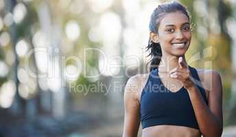 Will you join me on this challenge. Portrait of a sporty young woman exercising outdoors.