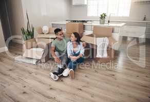 Are you ready to turn this house into a home. an affectionate sitting together in their new home.