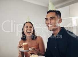 This two man party is the best. a young couple eating cake at home.