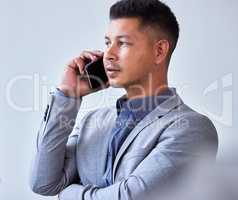 Thank you getting on contact. a young businessman using his smartphone to make a phone call.