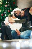 Youre always on my Christmas wish list. a happy young couple celebrating Christmas at home.