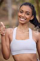 Dont stop believing in yourself. Portrait of a sporty young woman showing thumbs up outdoors.