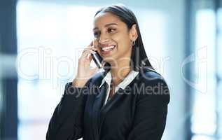 Hi its been so long since we last spoke. a young businesswoman taking a call on her smartphone.