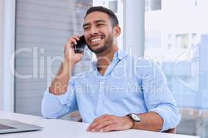 Im happy to discuss this deal. a young businessman using his smartphone to make a phone call.