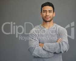 Id rather be myself. a handsome young man standing against a grey background.