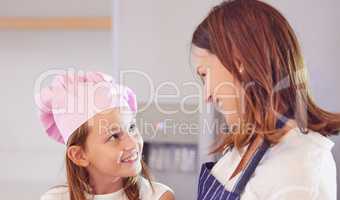 Are you sure about that, Mum. an attractive young mother bonding with her daughter in the kitchen at home while baking.