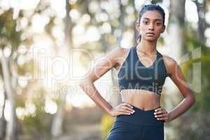 Dont limit your challenges - challenge your limits. Portrait of a sporty young woman exercising outdoors.