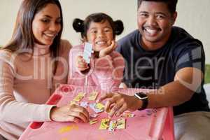 Help them develop problem solving skills at a young age. young parents helping their daughter build a puzzle.