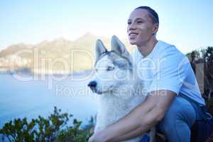 Look at these views. a handsome young man and his pet husky enjoying an early morning hike in the mountains.