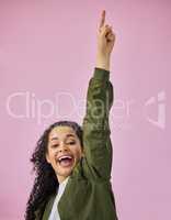 To the moon. an attractive young woman standing alone against a pink background in the studio and pointing upwards.