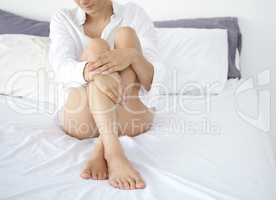 So soft to the touch. an unrecognizable young woman showing off her silky soft legs while sitting on her bed at home.