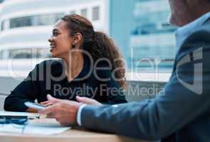 It feels so inspiring to be out here. a young businesswoman having a meeting with a colleague on the balcony of an office.