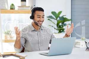 Congratulations you did it. a young man helping a customer online at work in a modern office.