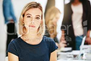 Portrait of proud, confident and serious female designer, manager or assistant inside a blurred office boardroom with team. Face of a focused, ambitious woman with attitude in a business meeting