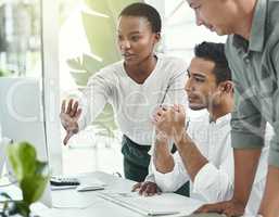 Theyre captivated by her vision for this project. three colleagues having a discussion in a modern office.