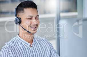Welcome sir how may we help you. a young businessman working in a call center office helping a client.