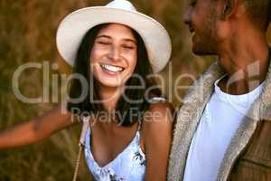 Made for one another. a young couple enjoying the sunset walk with outside in nature.