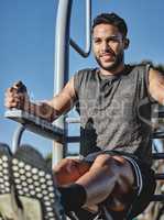 You will only reap what is equal to your efforts. a muscular young man exercising at a calisthenics park.