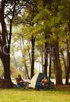 We dont need a holiday villa, we just need nature. a young couple camping in the wilderness.