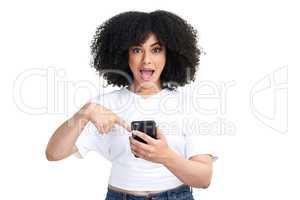 Before you leave, have you seen this. Studio shot of an attractive young woman using a smartphone and looking shocked against a white background.