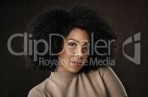 Were all a work of art. Cropped portrait of an attractive young woman posing in studio against a dark background.