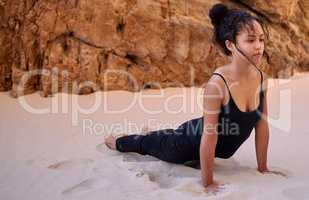 Find a place that brings you peace and visit it often. a young woman practising yoga outdoors.