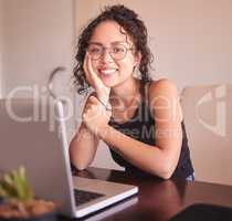 Dont waste your free time, use it to learn something new. a young woman sitting with her laptop at home.