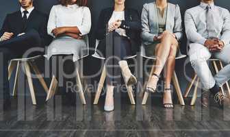 Interview group of corporate job applicants sitting in waiting room. Potential employees in recruitment agency stand by to see human resources manager. Professional businesspeople seeking employment