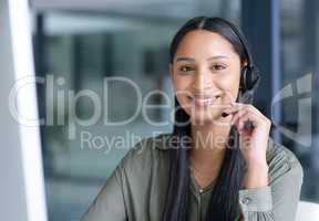 Its about responding directly to the needs of customers. Portrait of a young call centre agent working in an office.