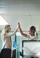 Teamwork, support and happy colleagues sharing high five in a modern office, excited about good news or feedback. Female coworkers celebrating success, expressing joy and collaborating on project