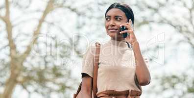 Imagine, believe, achieve. Cropped portrait shot of an attractive young female student using her mobile phone outside on campus.