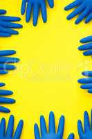 Grab a glove and get to work. Studio shot of rubber gloves against a bright yellow background.