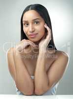 Being lazy wont get rid of your skin problems. a beautiful young woman with flawless skin posing against a grey background.