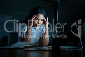 What seems impossible today could still pay off tomorrow. a young businesswoman looking stressed while using a computer during a late night at work.