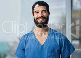 im here to assist with your healthcare matters. Portrait of a medical practitioner standing in a hospital.