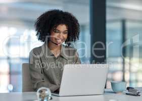 That winning feeling. a young female agent enjoying an interaction with a client while working in a call centre.