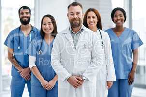 Delivering integrated care that makes a difference. Portrait of a group of medical practitioners standing together in a hospital.