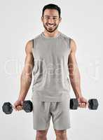 3 reasons I workout gains, gains and gains. Studio portrait of a muscular young man exercising with dumbbells against a white background.