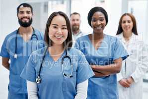 Here to help you take the path to improved health. Portrait of a group of medical practitioners standing together in a hospital.
