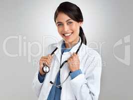 Did someone call for a doctor. Studio portrait of a confident young doctor posing against a grey background.