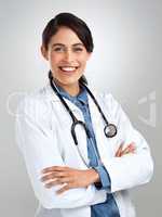 Dont fear, excellent health care is right here. Studio portrait of a confident young doctor posing against a grey background.