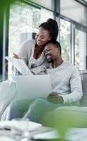 Financial freedom affords you the gift of a happy life. a young couple going through paperwork at home.