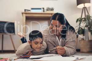The kind of math app you can count on. an adorable little boy completing a school assignment with his mother at home.